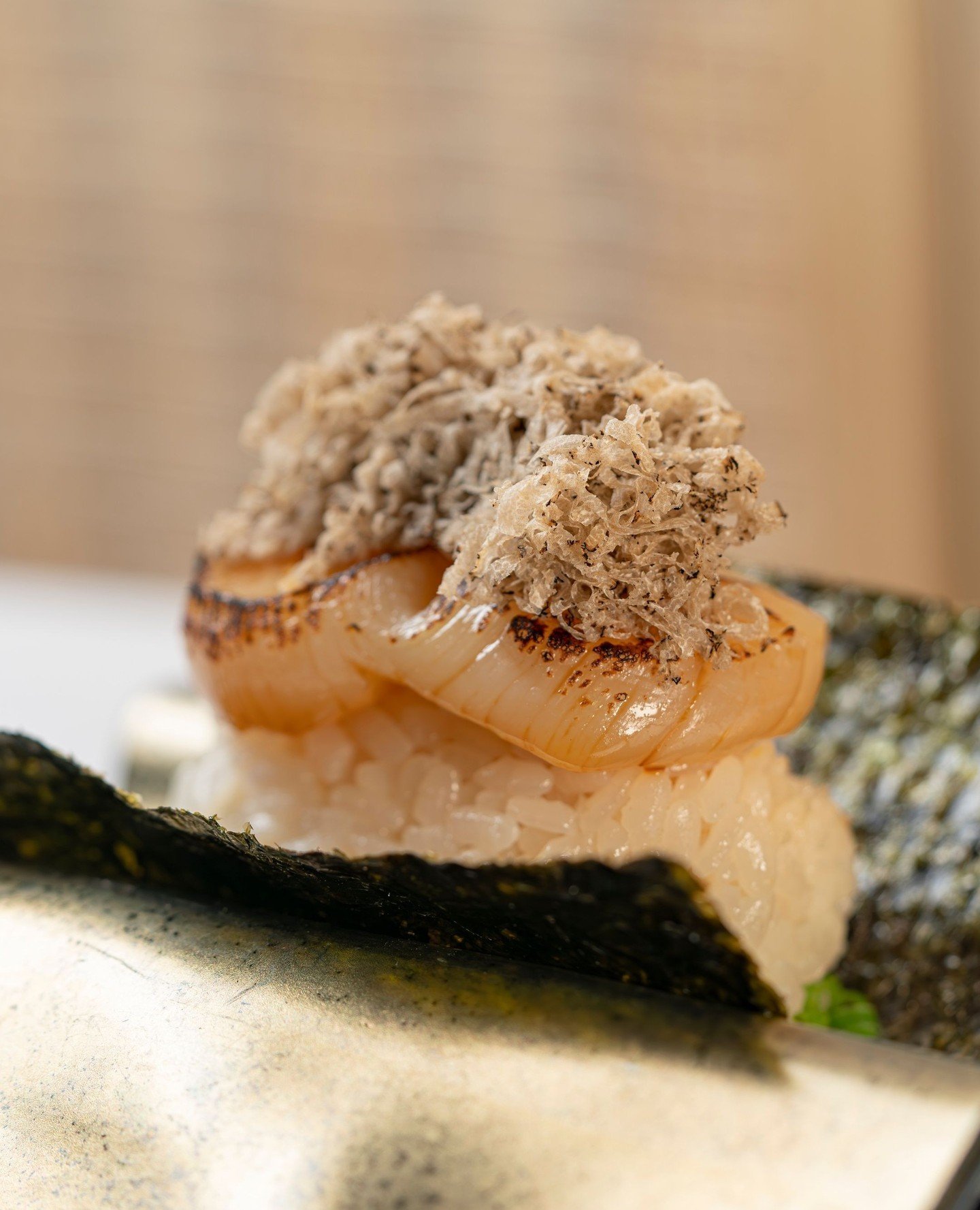 Scallop Truffle Hand Roll. ⁠
One bite. That's all it takes.