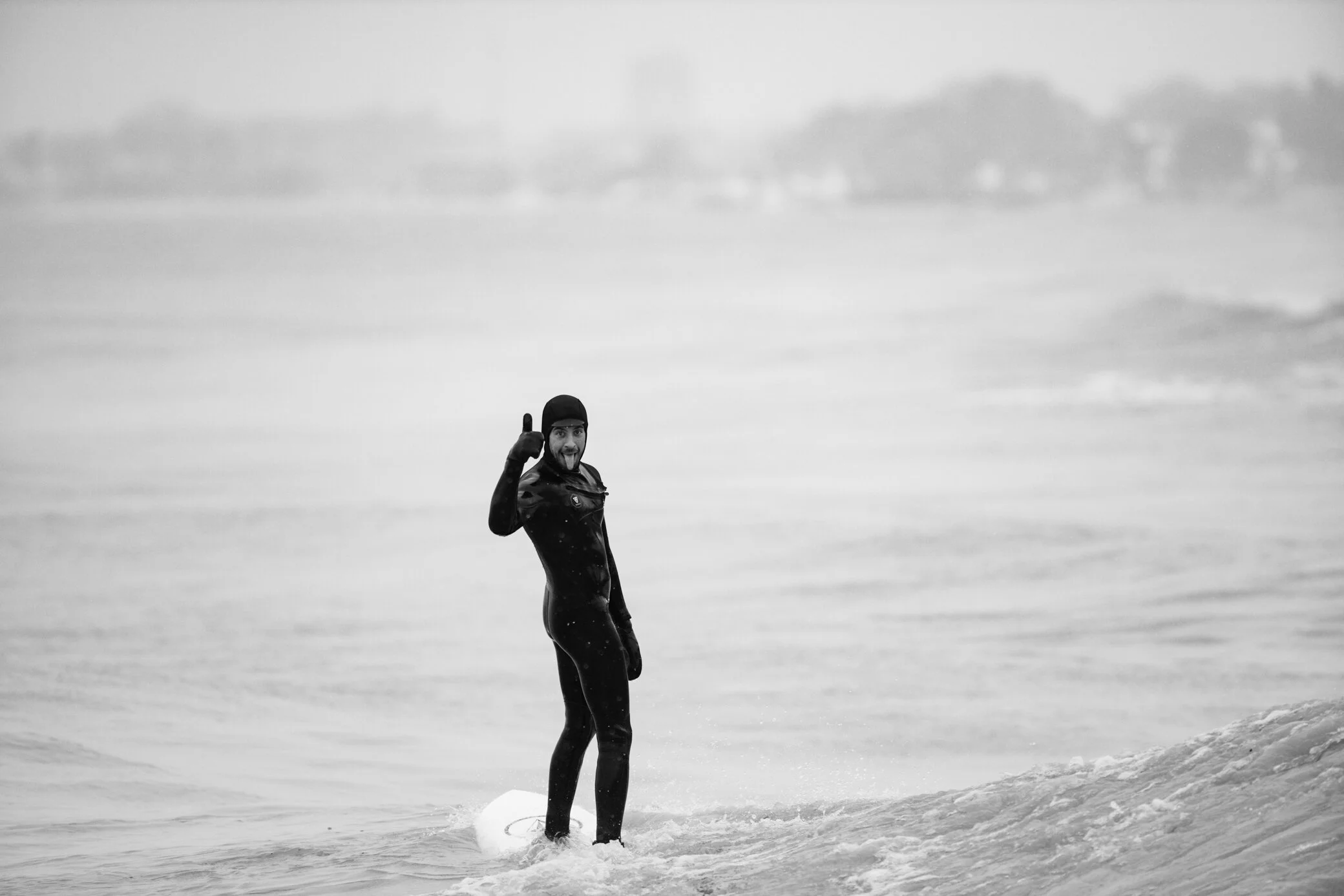Jake Bresette, owner of Lake Effect Surf Shop….. he is the one that invites me out and he posed for this shot as he spotted me getting soaked on the rocks.