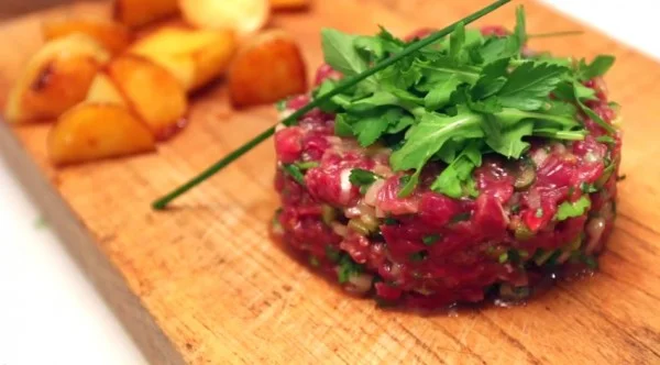 This is not cookie dough. This is steak tartare . Otherwise known as fully and completely raw meat with a bit of mustard. Source: French Guy Cooking