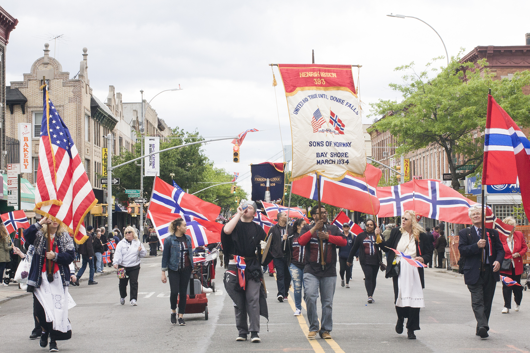 The Sons of Norway Lodge from Islip, NY marches in the parade. Membership lodges for Norwegian Americans from all over the northeast march in the parade, some with distinct floats or banners. 