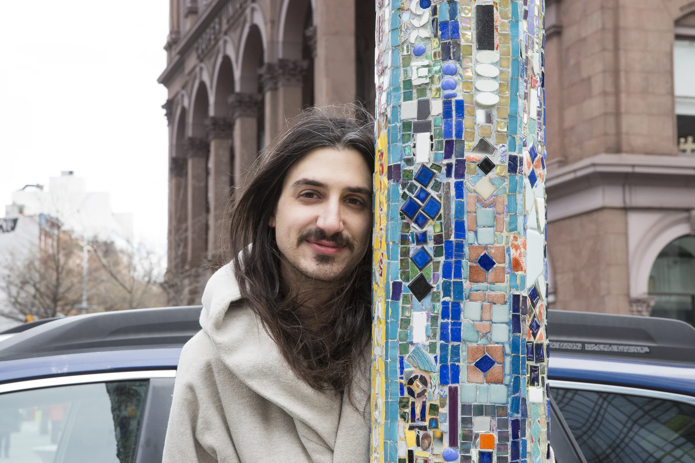  Aaron poses next to a decorated lamp post in Astor Place. These notable artworks are created by artist Jim Powers. Today Astor Place has 7 of the refurbished mosaic posts. 