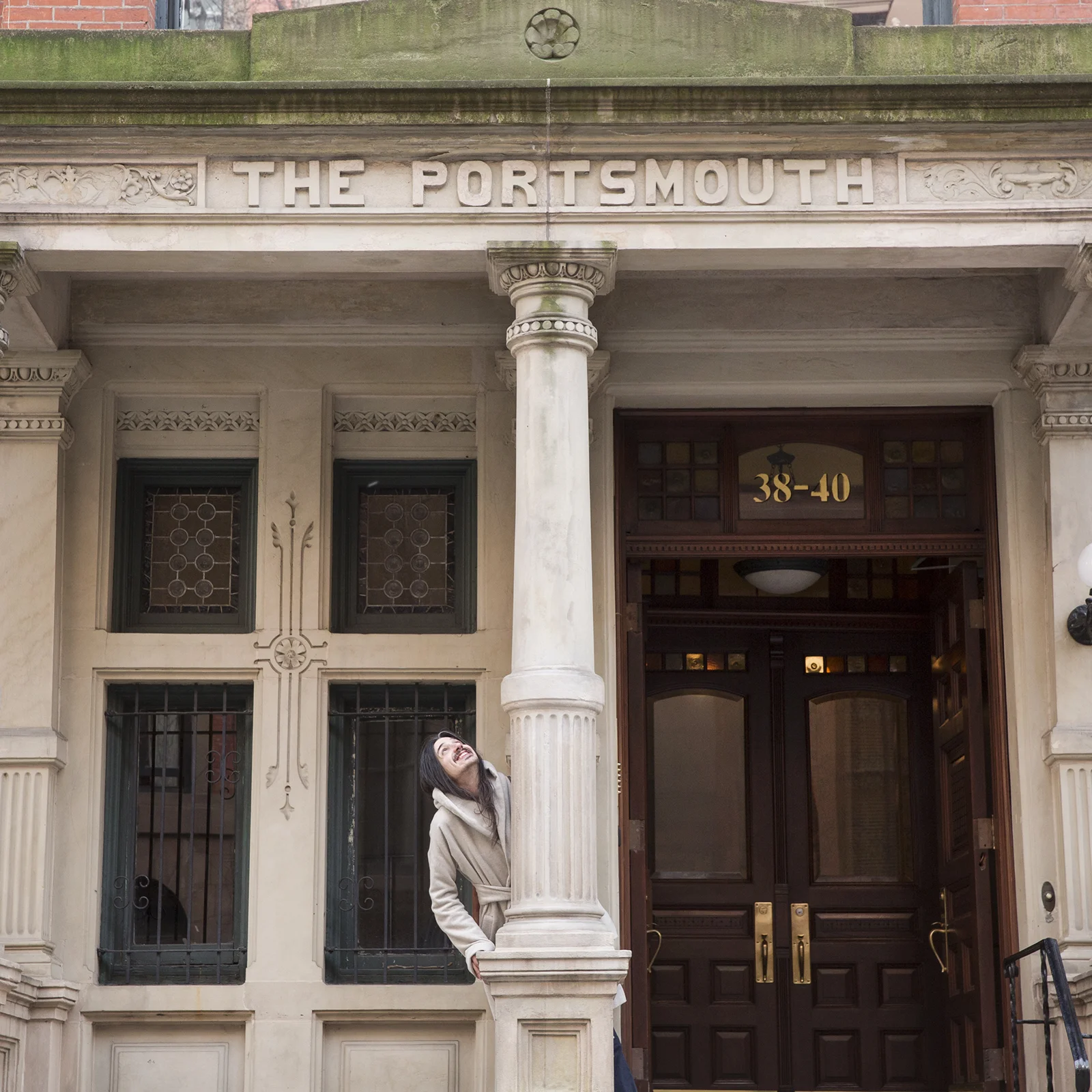  Aaron sits on the stoop of a building, the stone lettering uses a slight reverse-stress treatment, resulting in some letters appearing top-heavy (note the “E,” the “R,” and the “S”). While it’s more common to find bottom-weighted letterforms in any 