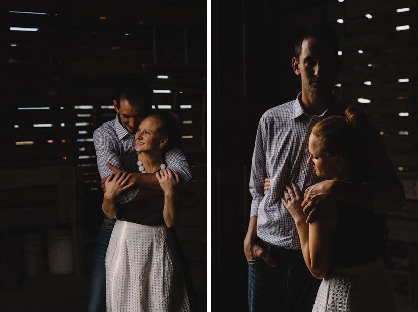 Erin and Scott throw arms around each other in the corn crib
