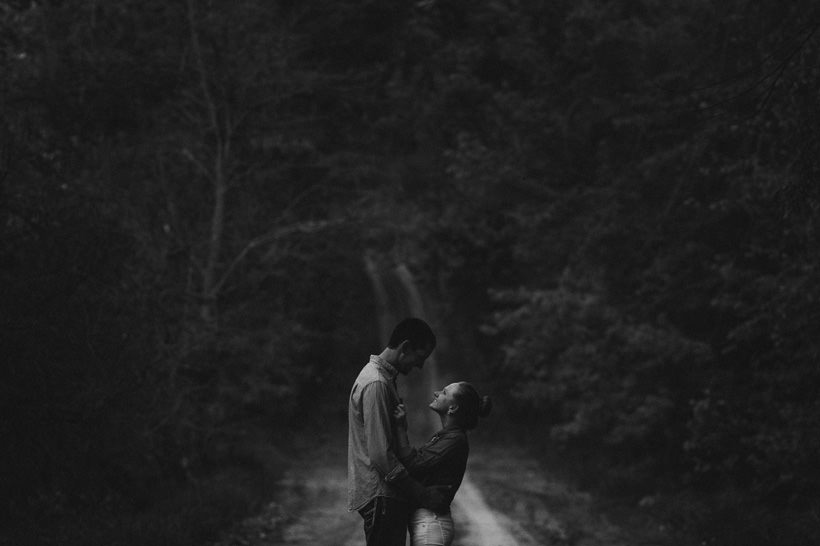 A dark, mood shot of Erin looking into Scott's eyes
