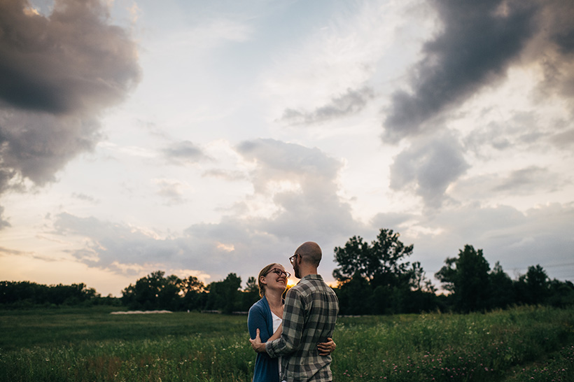 Aliza and Dan hugging in a field