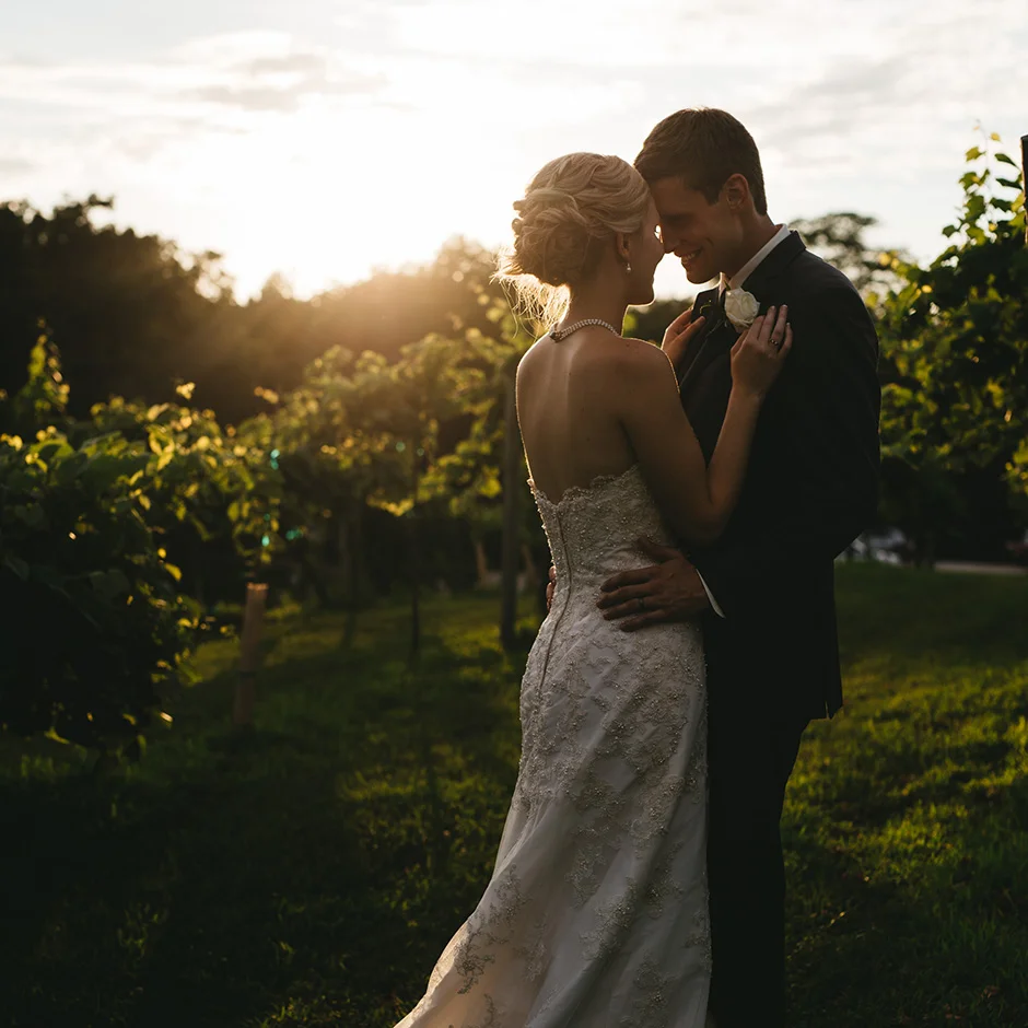 Emily and Josh hold each other as the sun goes down | Des Moines Wedding Photographer Brian Davis