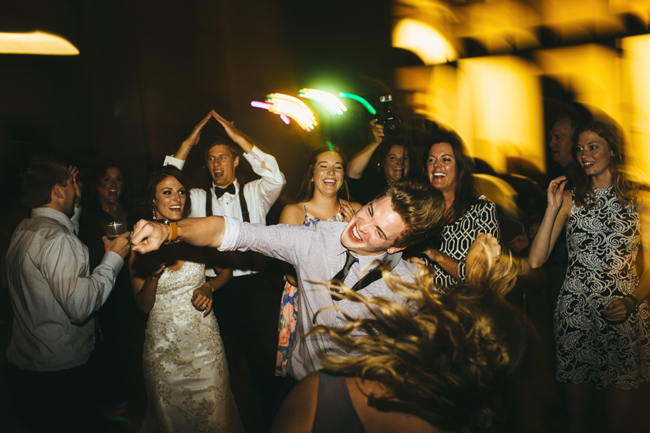 An energetic guest does the whip during Blake and Justin's Emmetsburg, IA Wedding