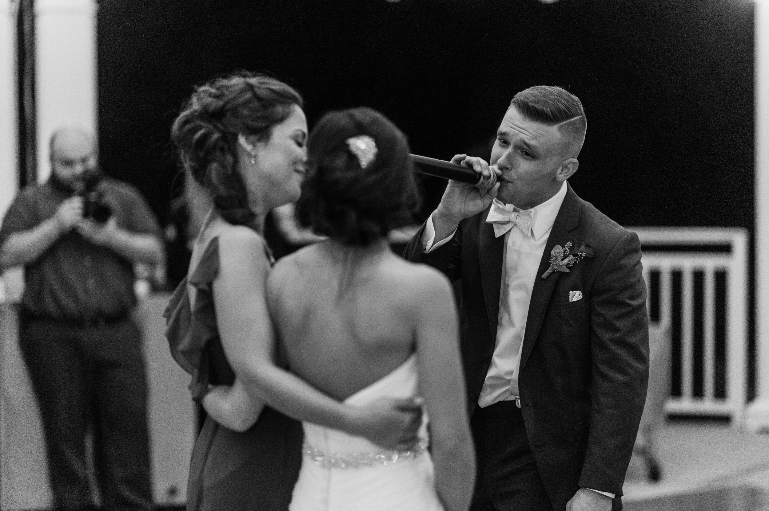 Sean singing for his beautiful bride at their wedding | Iowa Wed