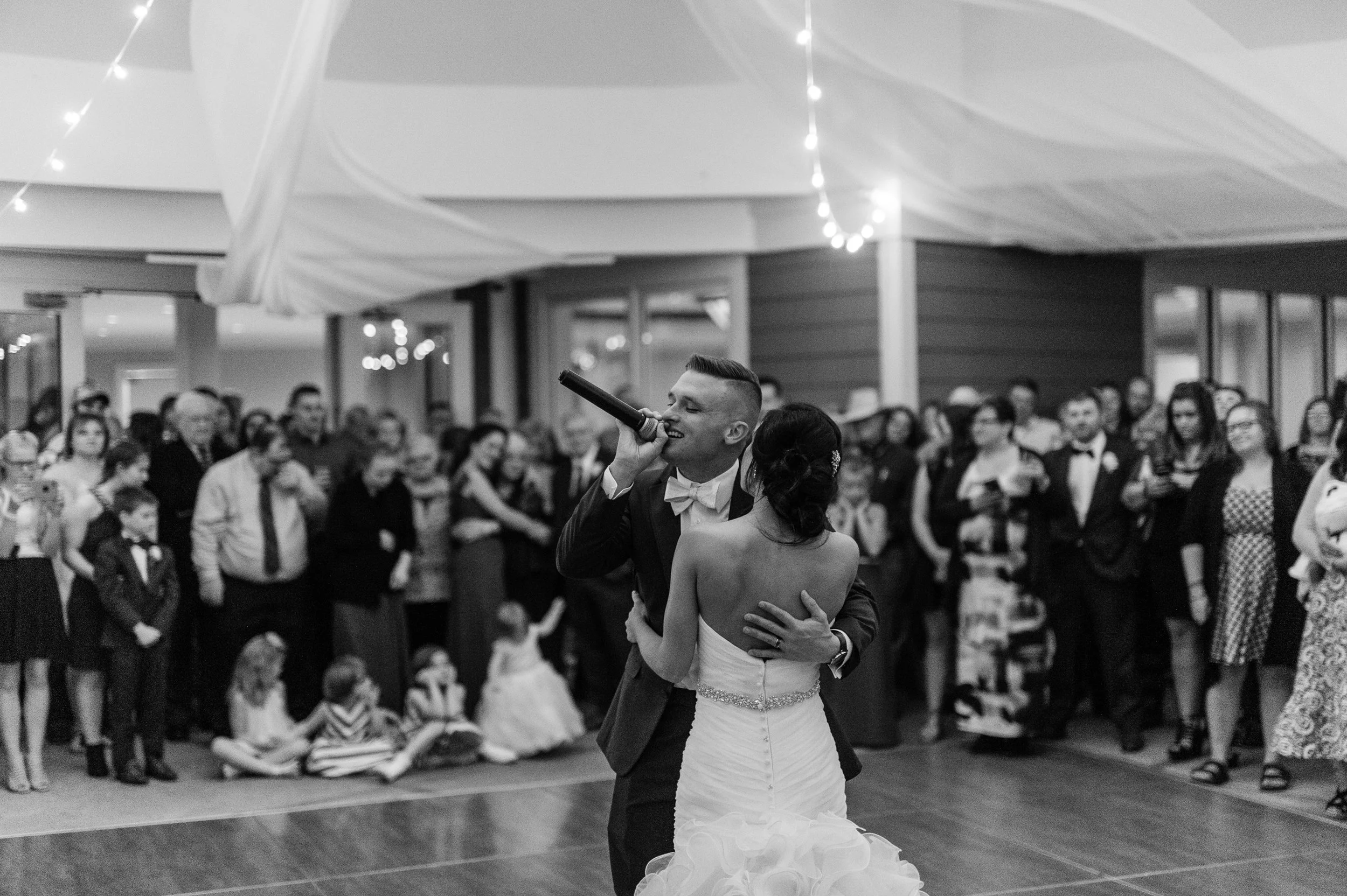 Sean singing for his beautiful bride at their wedding | Iowa Wed