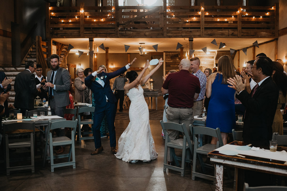 Thanh and Yome dabbed their grand intoduction | Iowa Wedding Pho