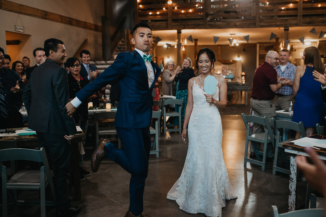 Thanh and Yome dabbed their grand intoduction | Iowa Wedding Pho