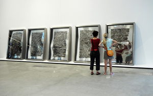 9 Whorled worlds and echoes from history: Jitish Kallat in conversation: Gene Sherman, Sydney jitish Kallat, Public Notice , 2003, installation view, 5th Asia Pacific Triennial of Contemporary Art, Queensland Art Gallery/Gallery of Modern Art, Brisbane, 2006–07; burnt adhesive on acrylic mirror, wood, stainless steel, 5 part series, 198.1 x 137.2 x 15.2cm each; image courtesy the artist