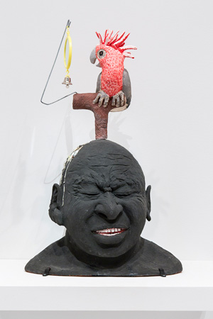 3 Breaking ground: A history of Indigenous ceramics: Kimberley Moulton Ricardo Idagi, False evidence appearing real , 2013, earthenware, wood, steel, plastic and glass, 60 x 37 x 27cm; National Gallery of Victoria, Melbourne, purchased through the Victorian Foundation for Living Australian Artists 2013; photo: Simon Anderson; © and courtesy the artist and Vivien Anderson Gallery, Melbourne