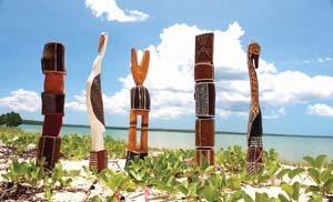 8 Pukumani: CHRIS RAJA Pukumani poles at Pirlangimpi Front Beach: photo: Sabrina Talarico, Munupi Arts