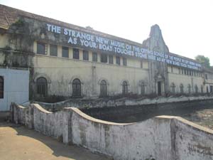 15 Biennale & beyond: Kochi-Muziris, South India: ROMAIN MAITRA Robert Montgomery, LED-lit text-based work on the wall of Aspinwall House, Fort Kochi, as part of Kochi-Muziris Biennale, 2012/13; image courtesy the artist; photo by Romain Maitra
