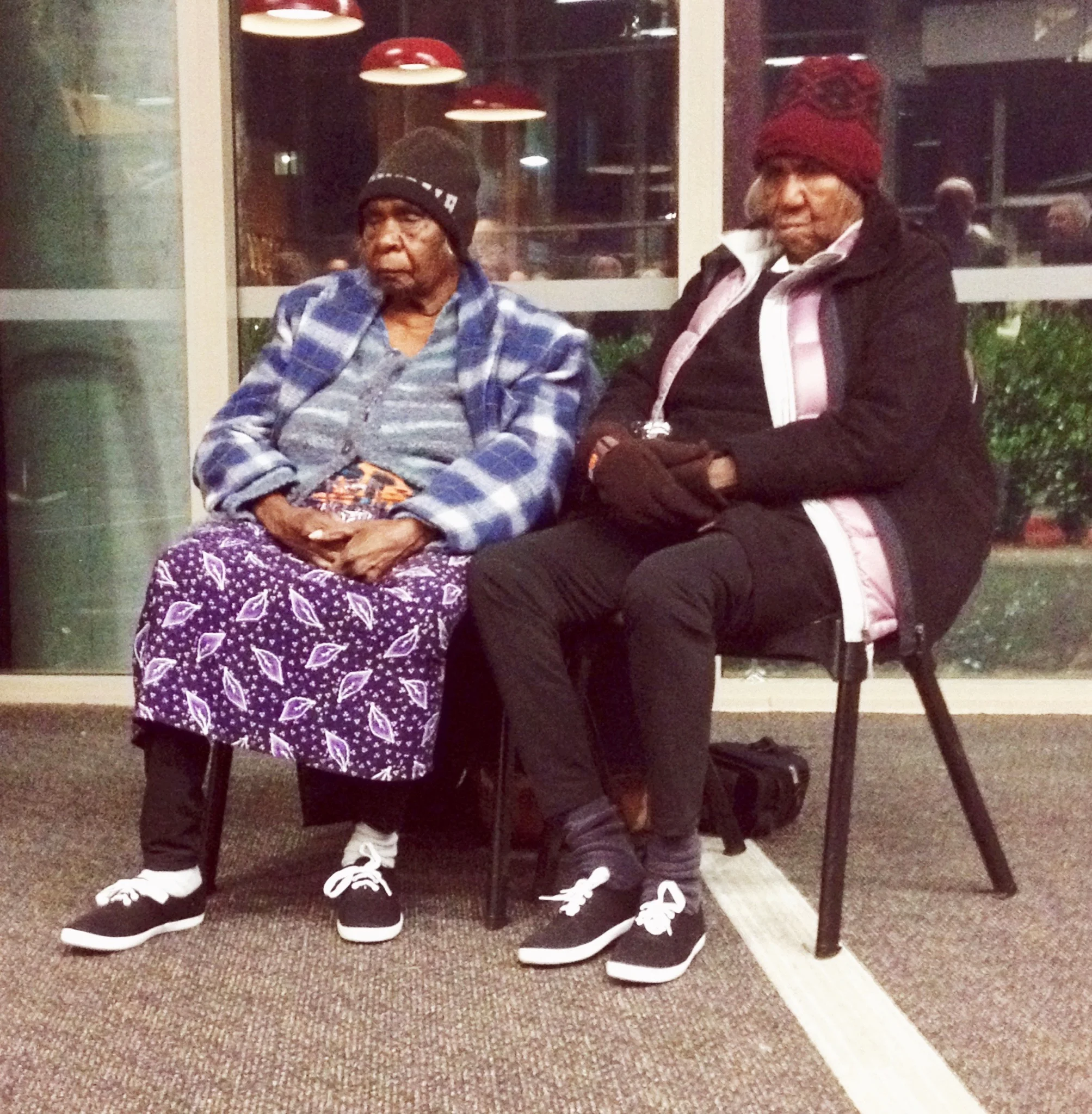 Linda Tjunkaya Syddick Napaltjarri and her sister Martha McDonald Napaltjarri, both around 80 years old, at the opening of 'Streets of Papunya'