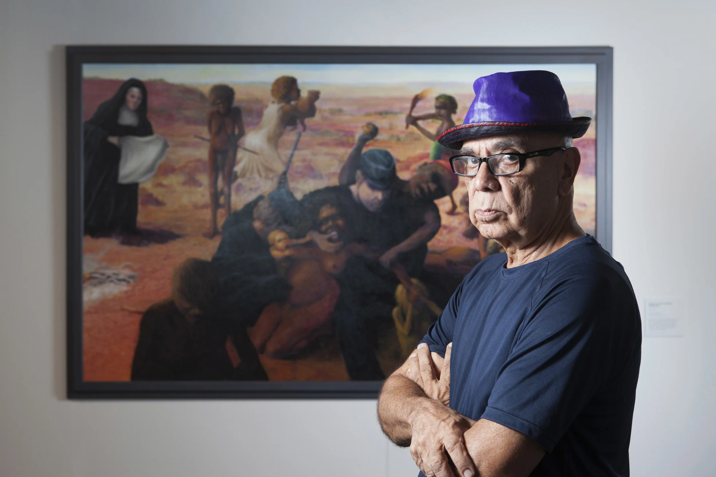 Harold Joseph Thomas (Bundoo) with his work Tribal Abduction , overall winner of the 2016 Telstra Art Award
