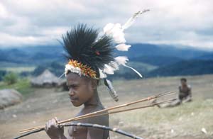 11 Through the Kunai Grass, Portraits of New Guinea Highlands 1951-53, Berndt Museum: EMILIA GALATIS Portrait of a young man holding bow and arrows, near Kainantu, Eastern Central Highlands PNG, 1951