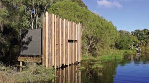 16 M12: Ornitarium BARBIE: GREENSHIELDS Front view of M12’s Ornitarium, 2011, local timbers, Wetlands Education Centre, Denmark, Western Australia. Image courtesy the artists. Photograph by M12