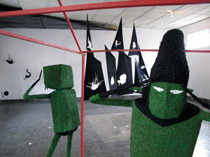 12 Ouija in Yogya: ASHLEY CRAWFORD Installation view, iCAN , with (foreground) Sigit Bapak , Refuse fairy tales about a frog inside a coconut shell (detail), 2009; and (background) Catriona Stanton, Haberfield Story (detail), 2009