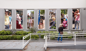 4 Wollongong Looks at Itself, JO HOLDER Installation view of Derek Kreckler’s Façade , 2009, digital proof 1 and 2 (14 images in total); installed at front of WCG. Photographs by Derek Kreckler. The frieze placement of the figures echoes the formation of Bert Flugleman’s Spiral and wave sculpture at the front of WCG. Proposals to show work in WCG’s 27 façade display panels are welcome via gallery@wollongong.nsw.gov.au
