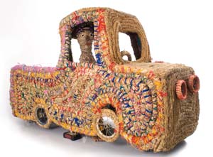5 ReCoil: a Celebration of Fibre Art in Australia: CHRISTIANE KELLER Kantjupayi Benson, Truck and Driver, 2007, grass, raffia, string, wool, wire, mesh, wheels, 112 x 190 x 75cm. Courtesy the artist and Tjanpi Desert Weavers