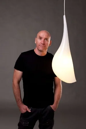 11 Robert Foster 1962 – 2016: Anne Brennan, Canberra Robert Foster with his F!NK Droplet Hanging Light, 2011; thermoformed acrylic, electrical components, ceiling plate, 60 x 3cm; image courtesy the estate of the artist