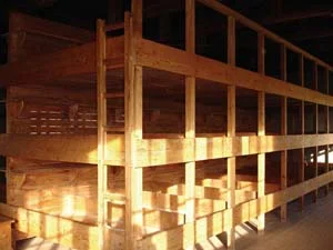 4 Political Kunst - Postcard from Germany, JENNY FRASER Beds at concentration camp, Dachau, 2008. Photograph by Jenny Fraser