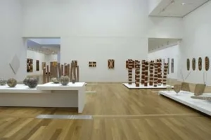 3 The Queensland Art Gallery &amp; its Gallery of Modern Art: DANIEL THOMAS   Installation view in December 2006 of the Gallery of Modern Art, Indigenous Australian Art Collection display, GoMA level 3, Gallery 3.2. The photograph shows work by artists including Thancoupie [Australia, b1937, Thainakuith people]; Emily Evans [Australia, b1975, Lardil language group]; Queenie McKenzie [Australia 1915-1998, Kija (Gidja)/Nakarra language group]; Ron Yunkaporta [Australia b1956, Wik-Ngathan language group]; Joe Ngallametta [Australia 1945-2005, Kugu Muminh/Kugu Uwanh language group]; Michael Boiyool Anning [Australia, b1955, Yidinyji language group]; and Desley Henry [Australia 1951-2005, Jirrbal language group]