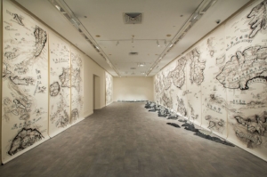 9 A multilayered mapping: The 5th Singapore Biennale: Tarun Nagesh, Singapore Qiu Zhijie, One Has to Wander through All the Outer Worlds to Reach the Innermost Shrine at the End , 2016, installation view, 5th Singapore Biennale, 2016; ink on paper, glass and stone, dimensions variable; collection of the artist, Singapore Biennale 2016 commission; image courtesy the artist and Singapore Art Museum