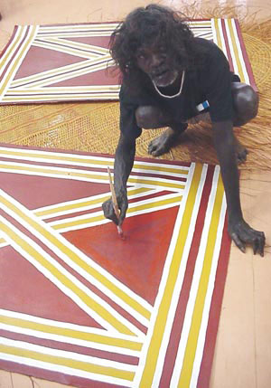 4 Two quiet men: Micky Garrawurra c 1940–2006 and Tom Djumburpur 1920–2006: DJON MUNDINE Micky Garrawurra painting. © Bula’bula Arts 2006