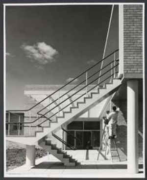 12 Remembering Tomorrow, As Modern as Tomorrow: Photographers in Postwar Melbourne: CHRISTOPHER HEATHCOTE Helmut Newton, Workmen putting the finishing touches to rear of amenities block , c. 1951–54, gelatin silver photograph, gift of the Shell Company of Australia, 2005