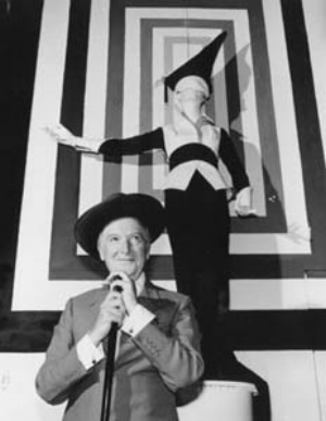 3 Up Close and Personal: Art and Fashion in the Museum: NADIA BUICK Cecil Beaton standing in front of an Ascot costume for My Fair Lady (1963) at his exhibition Fashion: An Anthology at the V&A , 1971