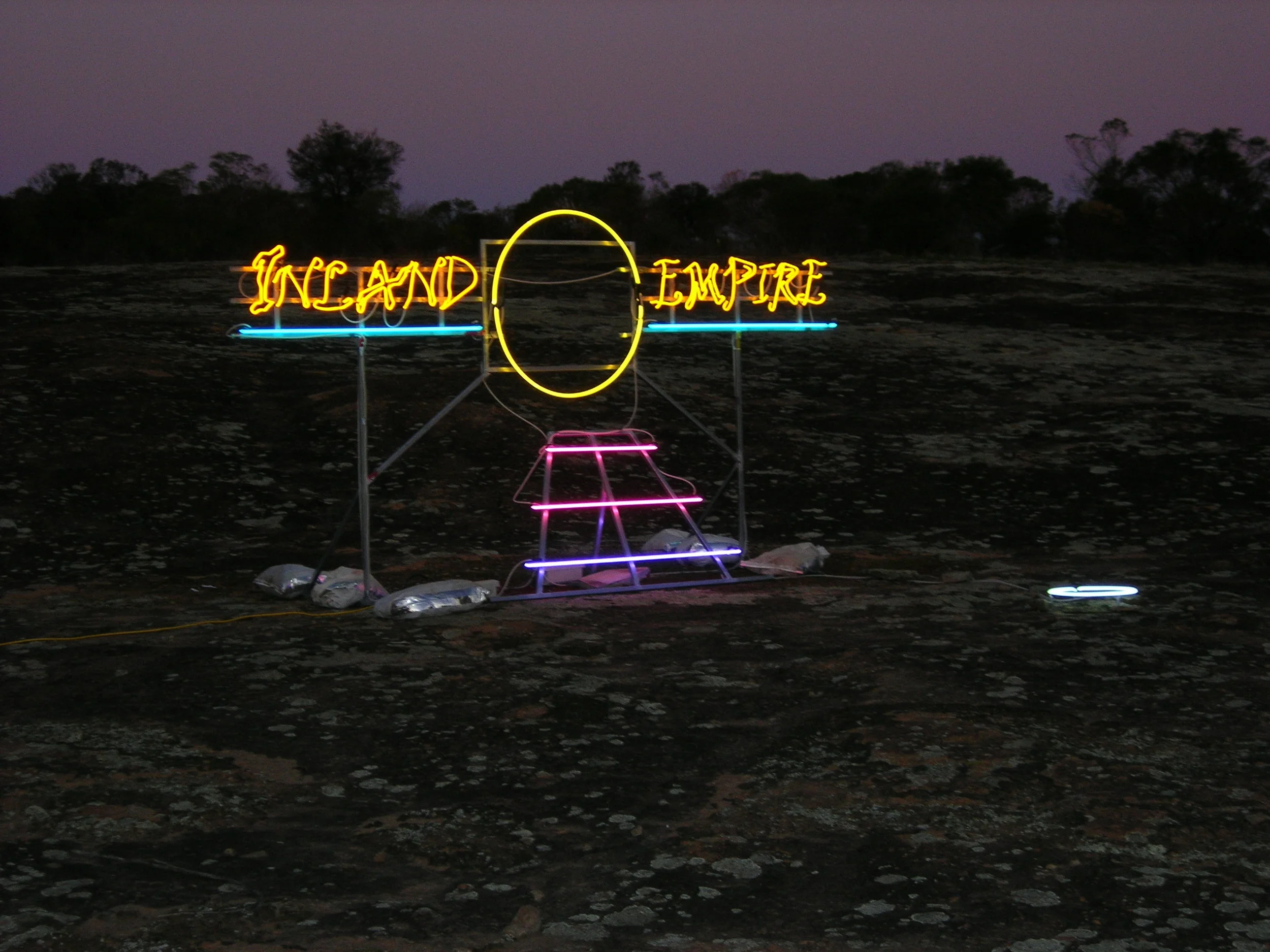 7 janet burchill and jennifer mccamley; culture jamming at heide: sophie Knezic,  melbourne    Janet Burchill and Jennifer McCamley,  Inland Empire , 2008, installation view, Kellerberrin, Western Australia, 2008; neon tubing, electrical components, scaffolding, dimensions variable; image courtesy the artists and Neon Parc, Melbourne; © the artists