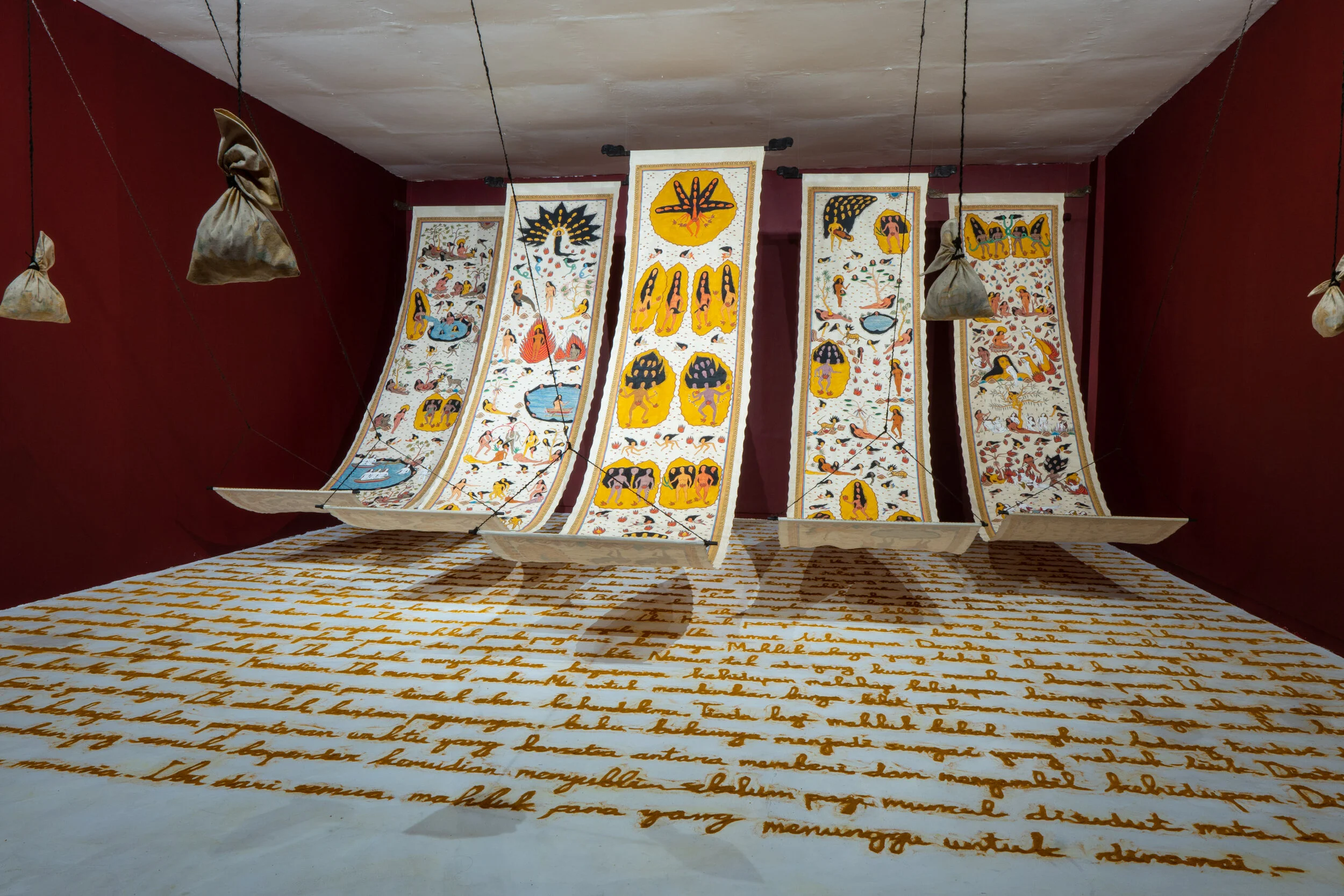 9 a playground at the earth’s middle: Chaitanya sambrani,  yogyakarta    Citra Sasmita,  Timur Merah Project: The Embrace of My Motherland , 2019, acrylic on Kamasan canvas with turmeric and spices, each scroll 400 x 90cm; photo: Documentation Team, Biennale Jogja 2019