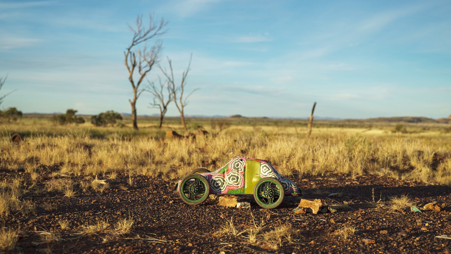  Noreen Parker,  Camouflage army truck , acrylic on found metal oil sump, pram wheels, fencing wire, 72 x 34 x 32cm; cinematographer: Devris Hasan; image courtesy Desart 