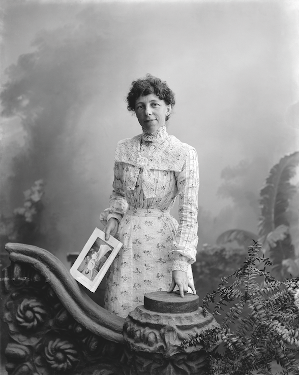  Tyree Studio (Rose Frank),  Rose Frank holding a photographic portrait , c. 1900, gelatin dry plate glass negative; Nelson Provincial Museum 