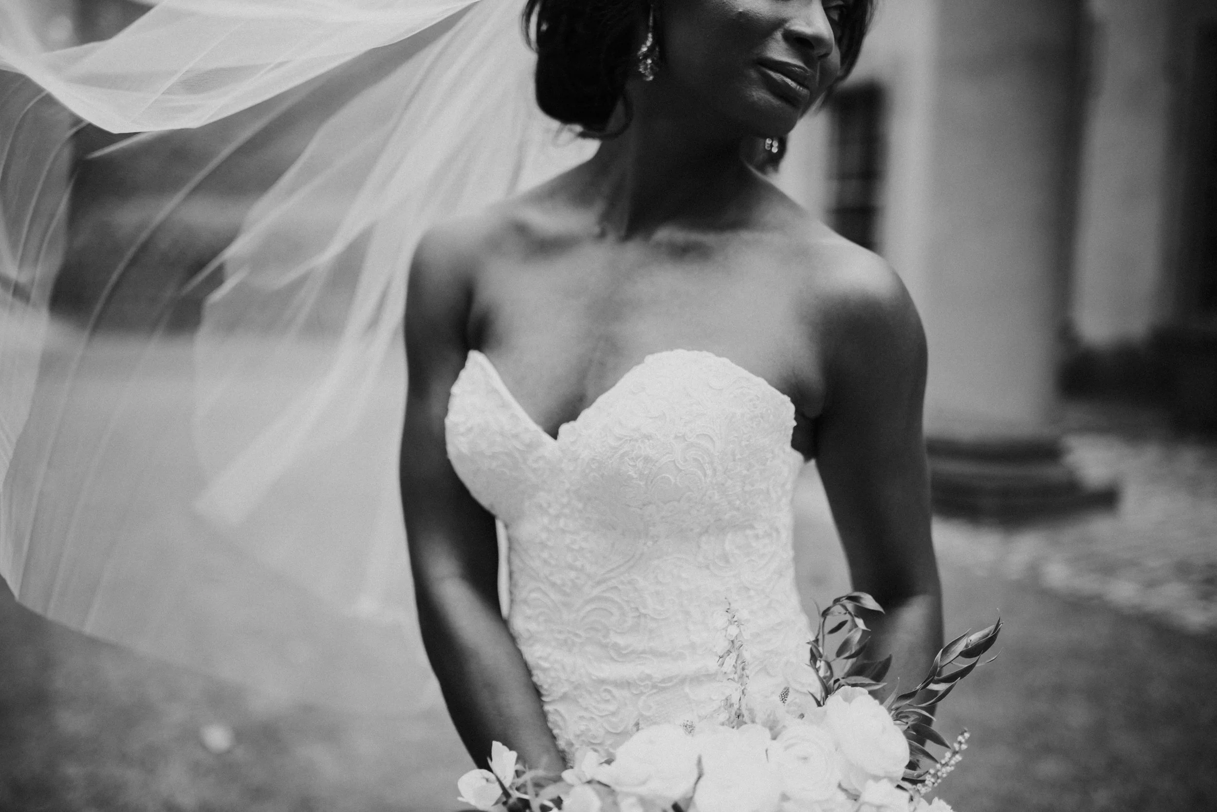 Details of bride in Martina Liana wedding gown and veil