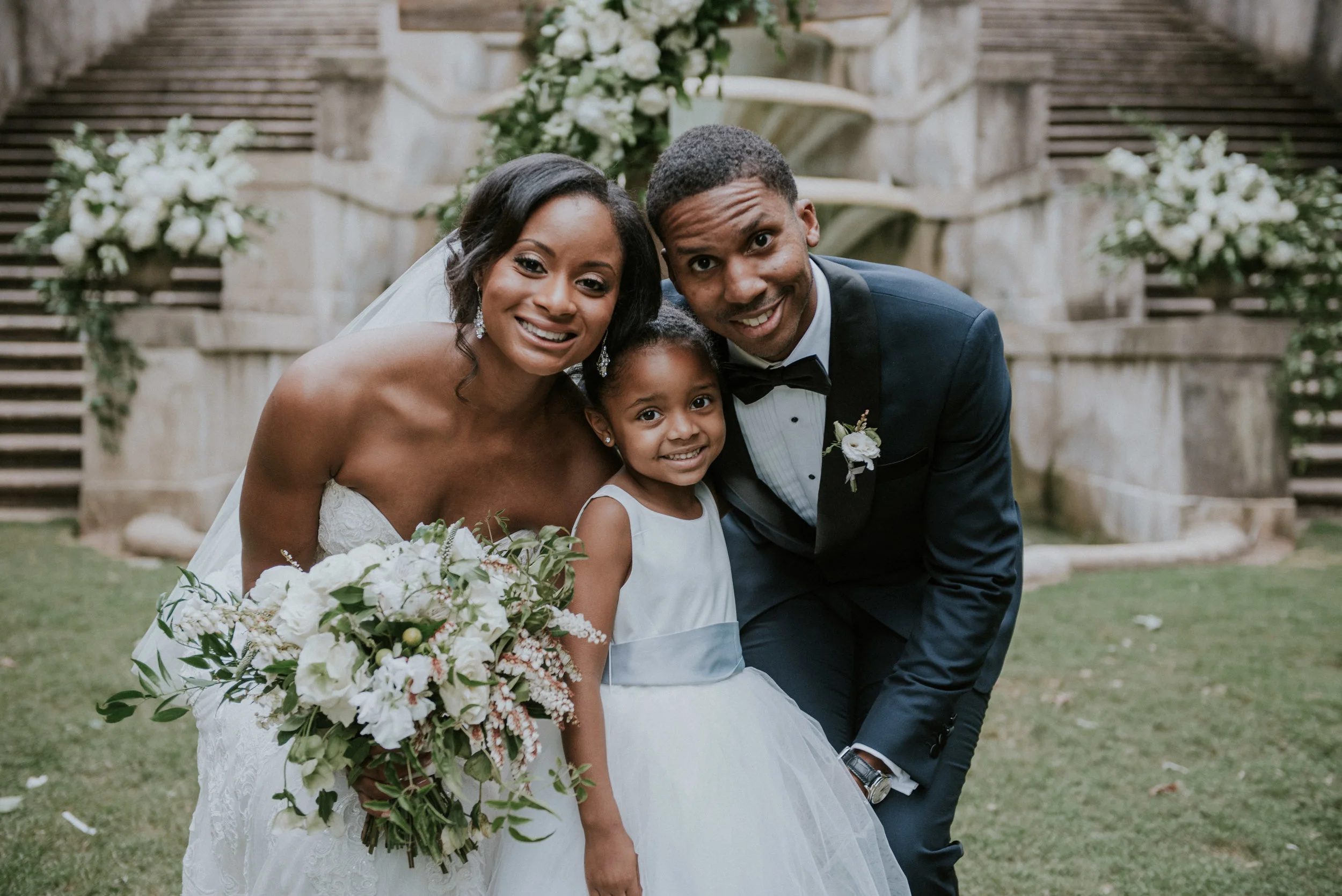Newlyweds with daughter at Swan House in Atlanta, GA