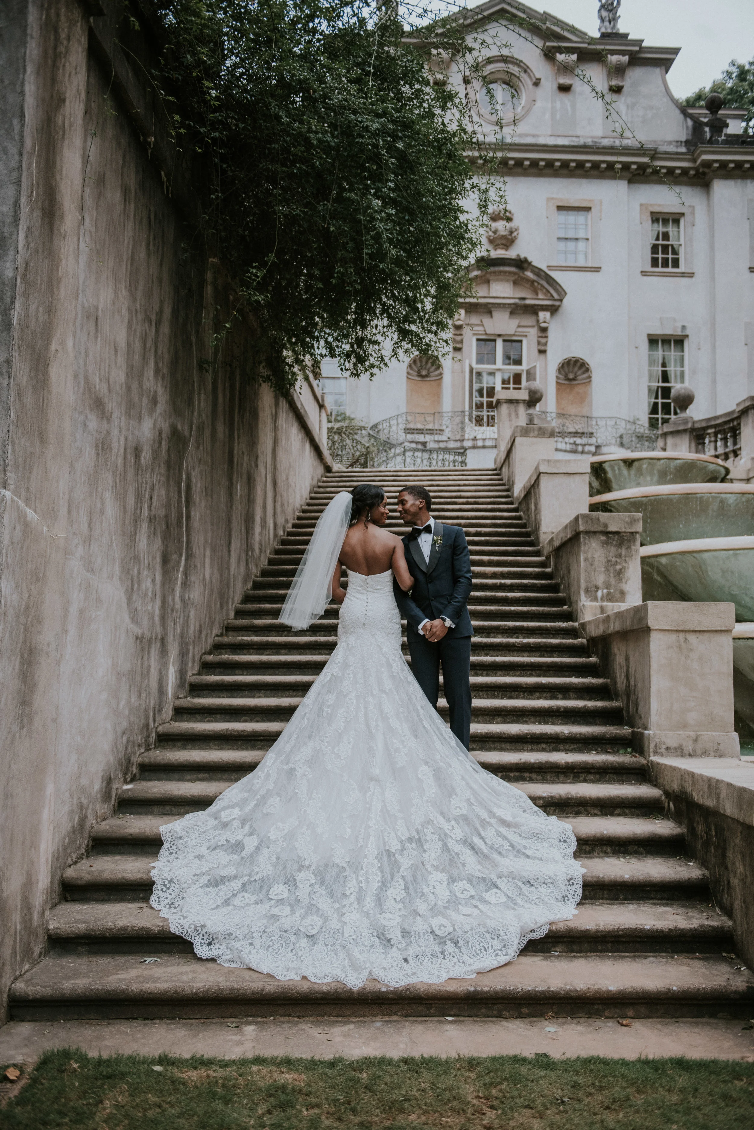 Bride's Martina Liana wedding dress on Swan House steps