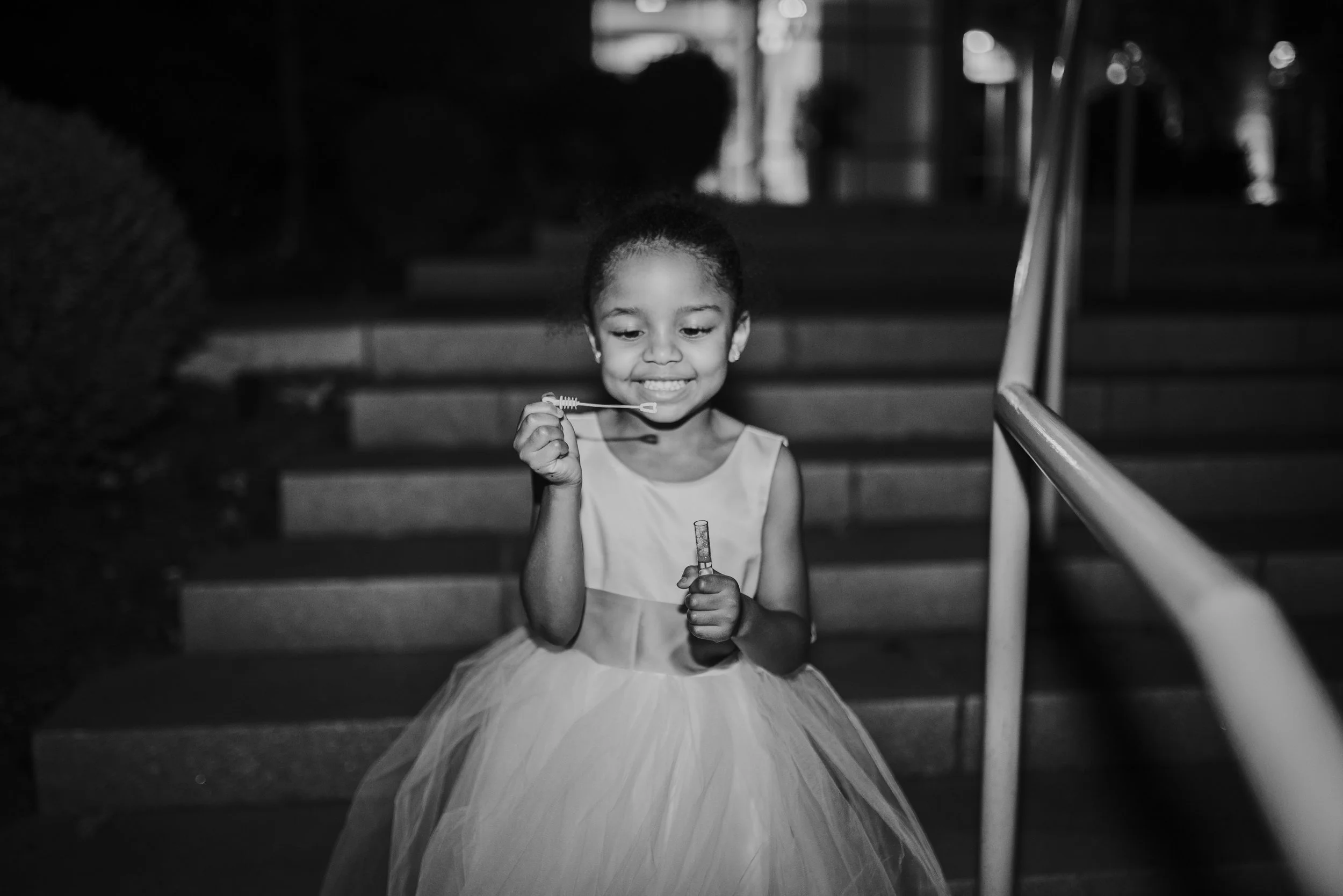 Flower girl blowing bubbles during grand exit