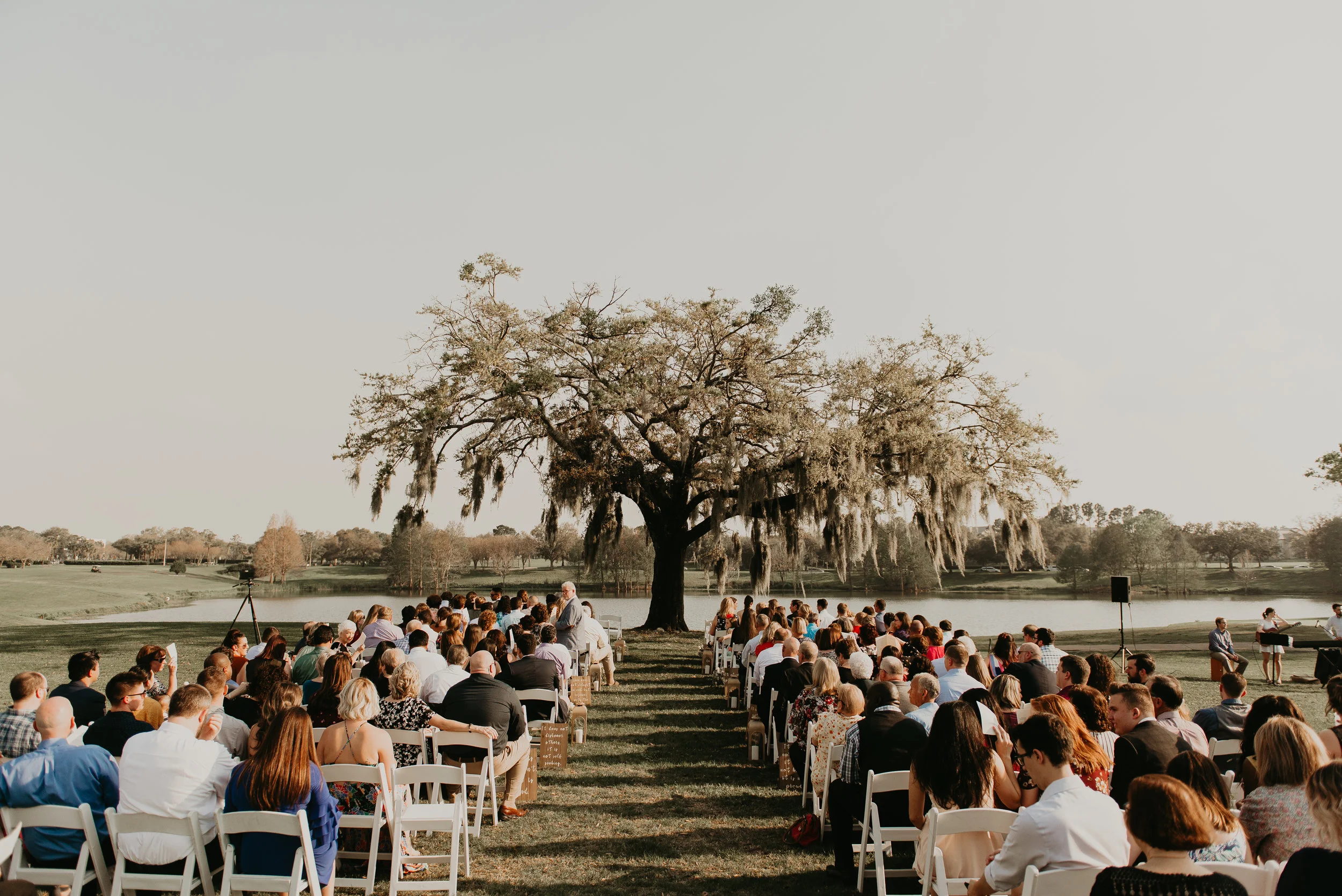 Wedding ceremony underneath tree at MetroWest Golf Club in Orlando, Fl