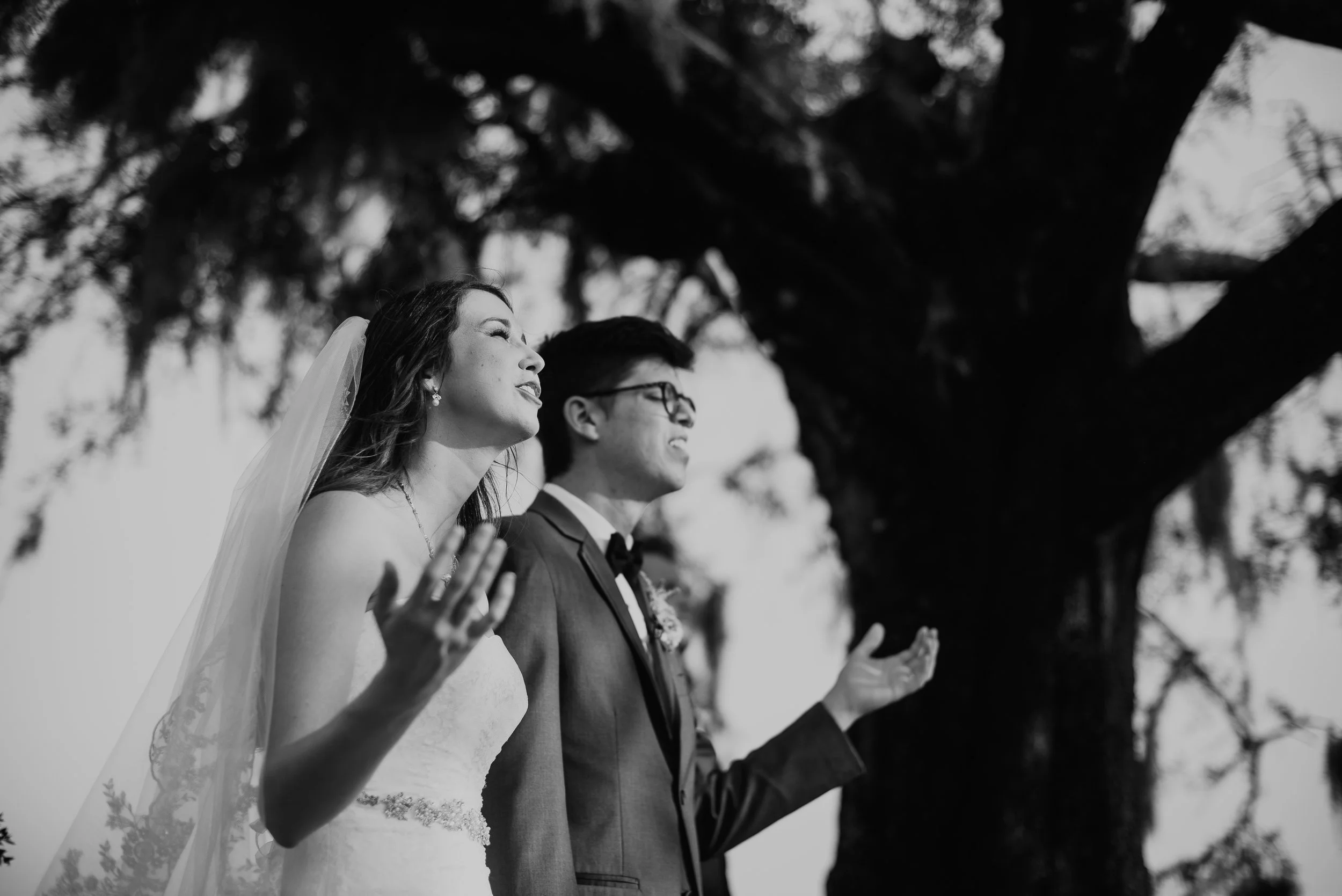 Bride and groom worship during wedding at MetroWest Golf Club