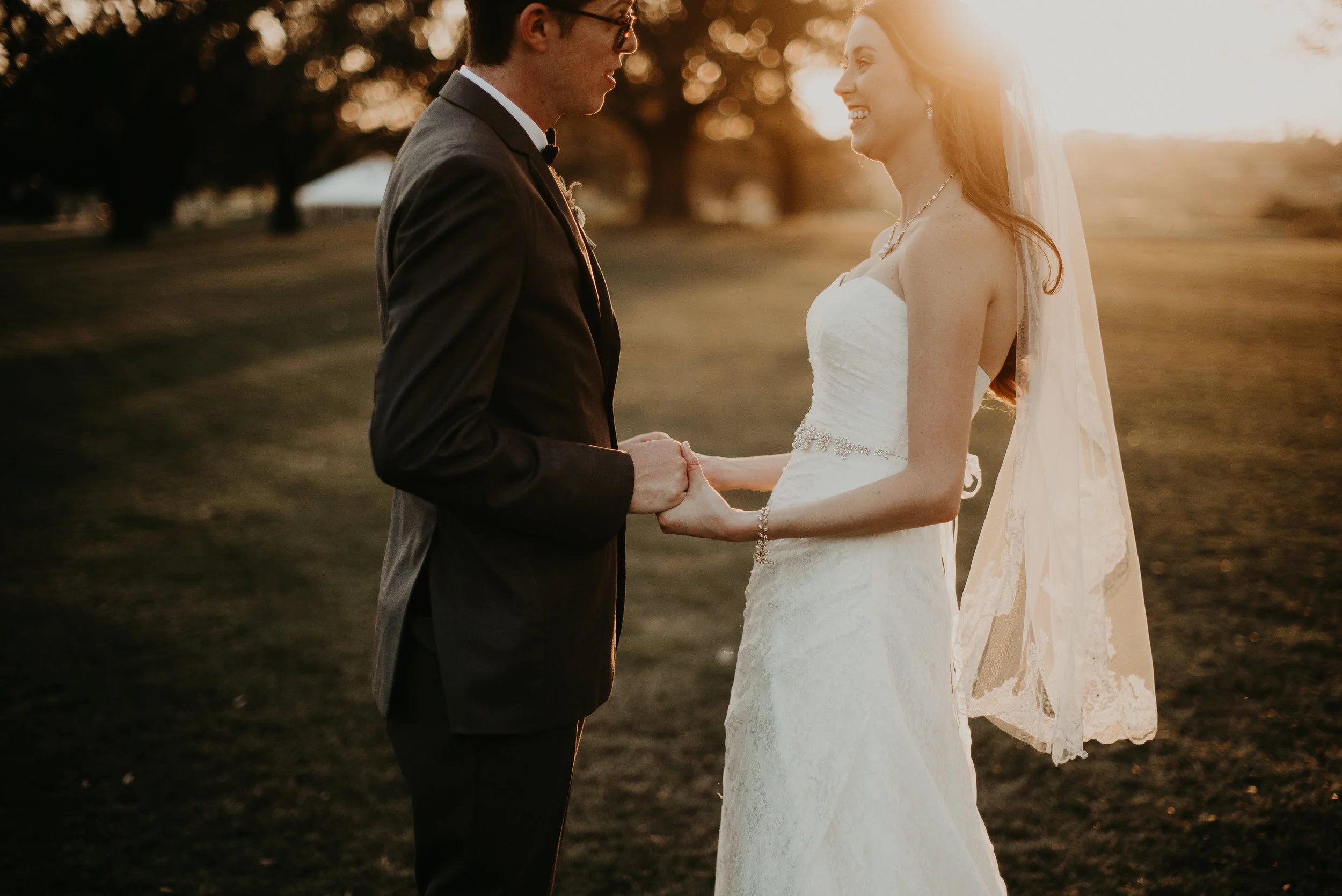 Bride and groom holding hands during sunset at MetroWest Golf Club in Orlando, FL