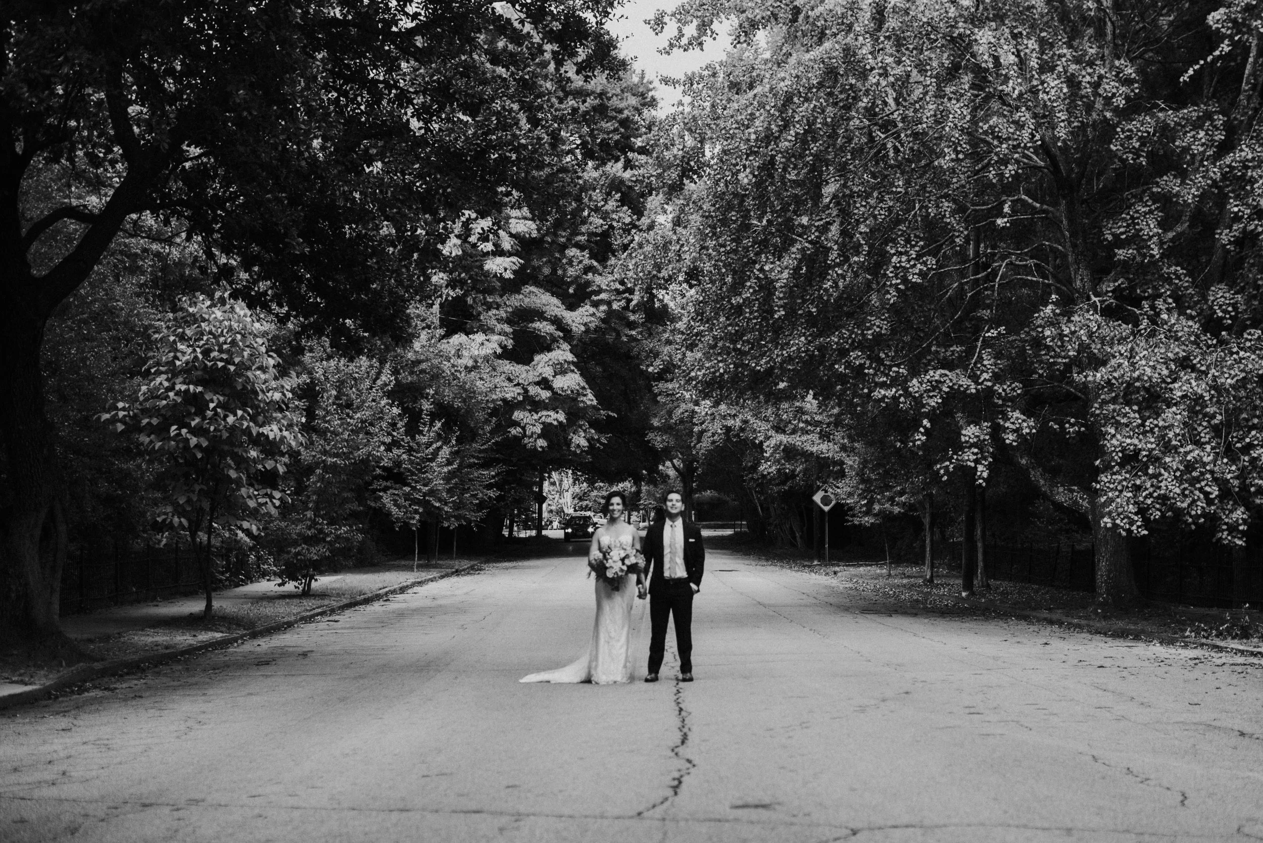 Newlywed couple standing in the street at The Trolley Barn in Atlanta, GA