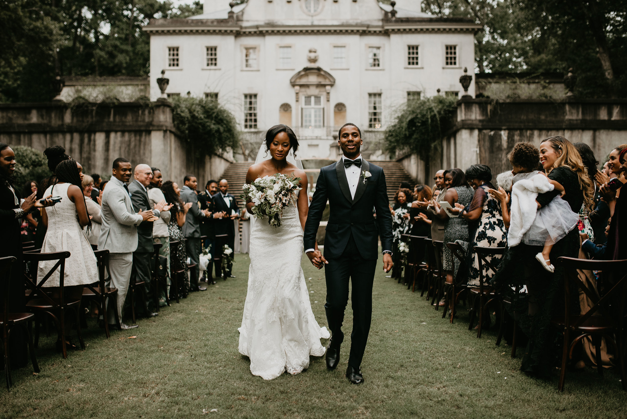 Bride and groom exit at Swan House Atlanta wedding