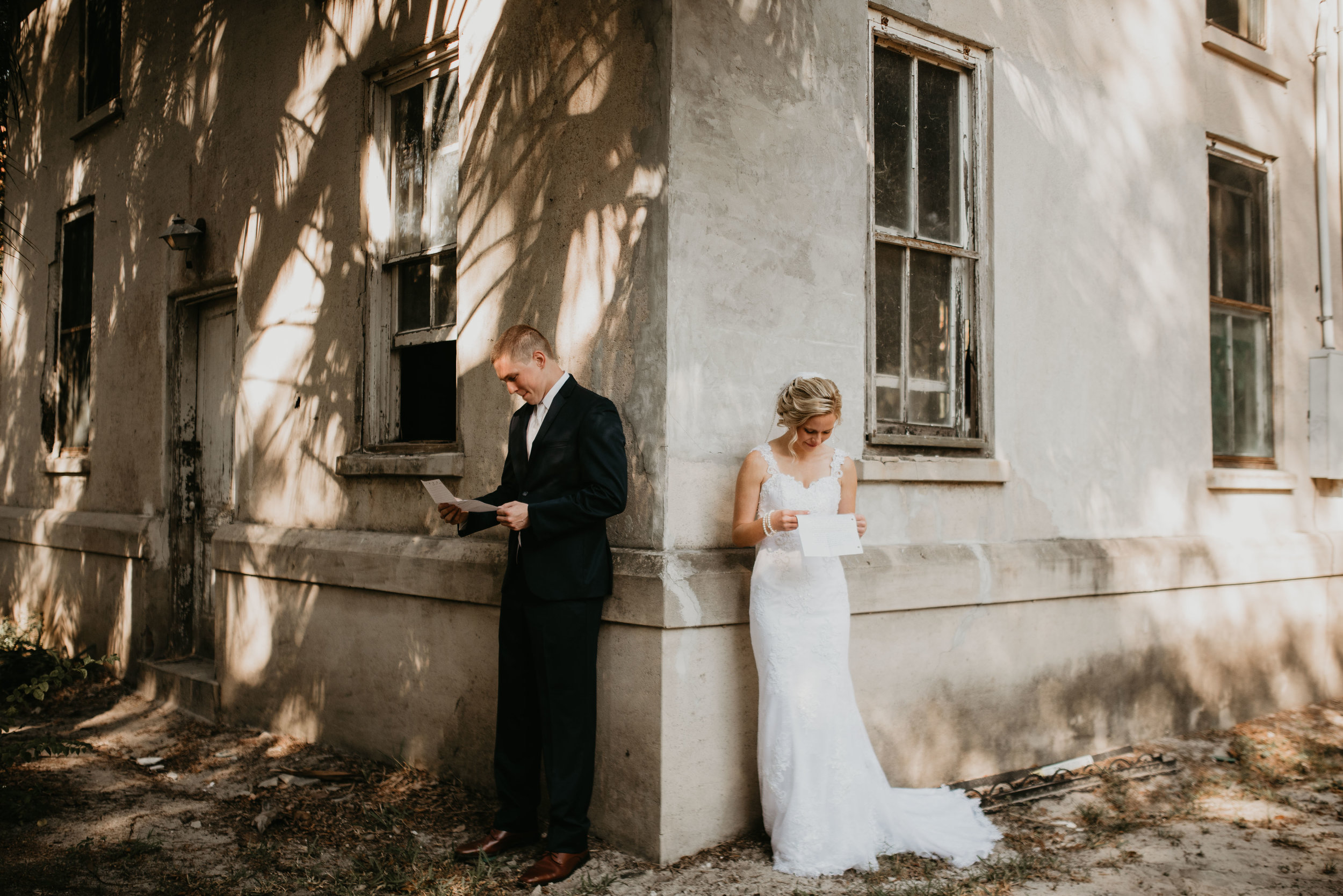 Bride and groom reading love letters at Sydonie Mansion in Mt. Dora, FL