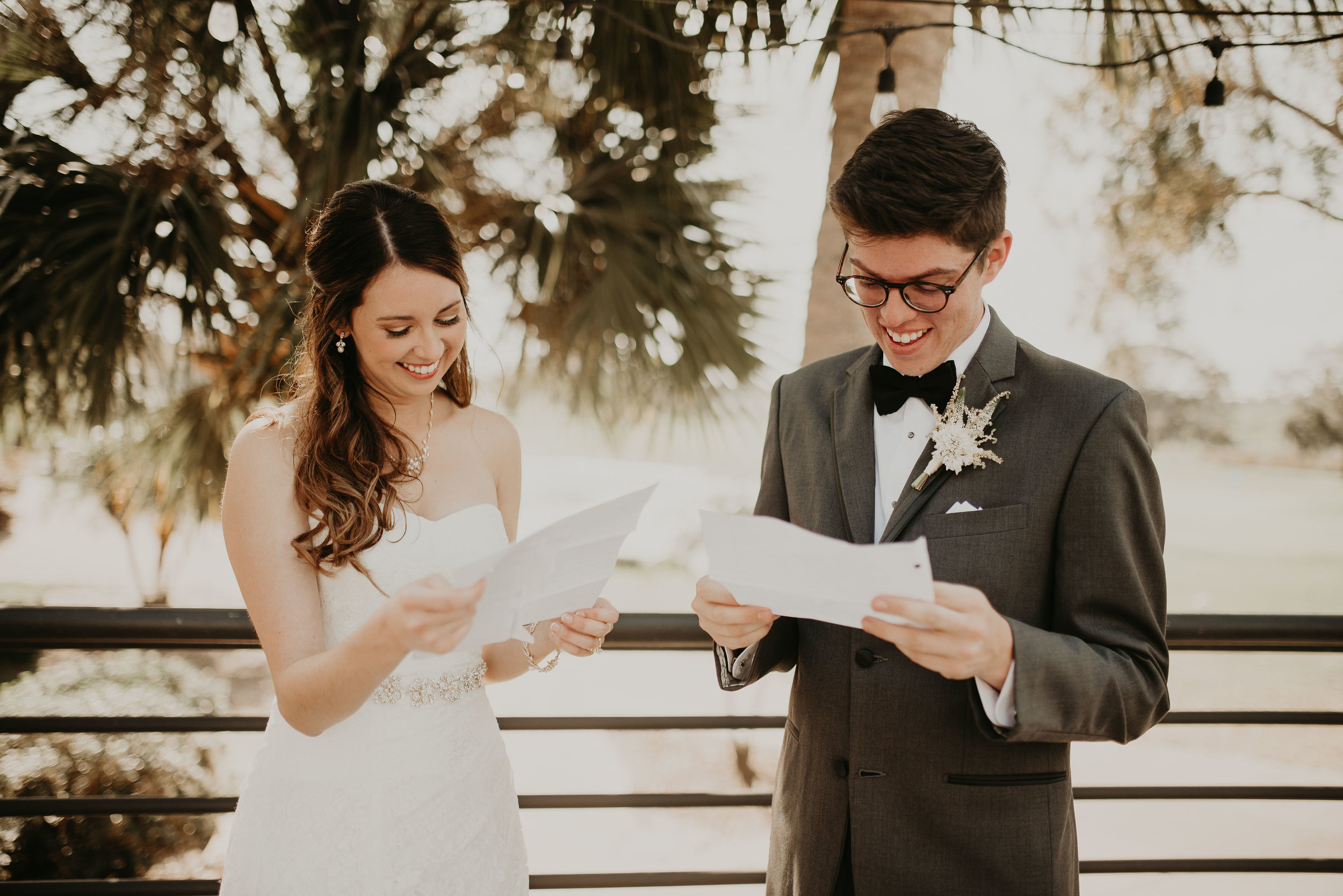 Bride and groom read love letters at MetroWest Golf Club in Orlando, FL