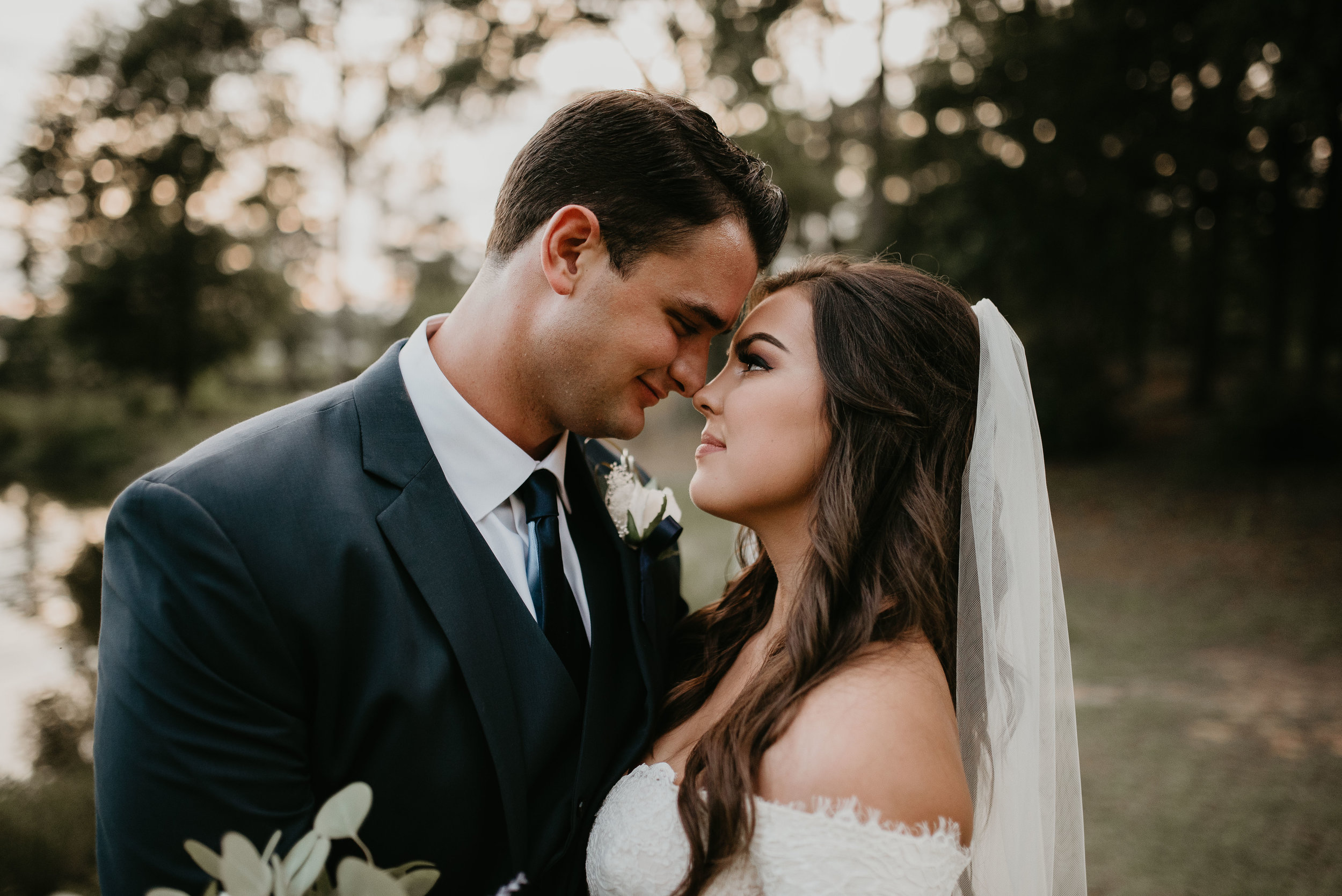 Bride and groom stare into each others eyes at Wesleyan College in Maceon, GA