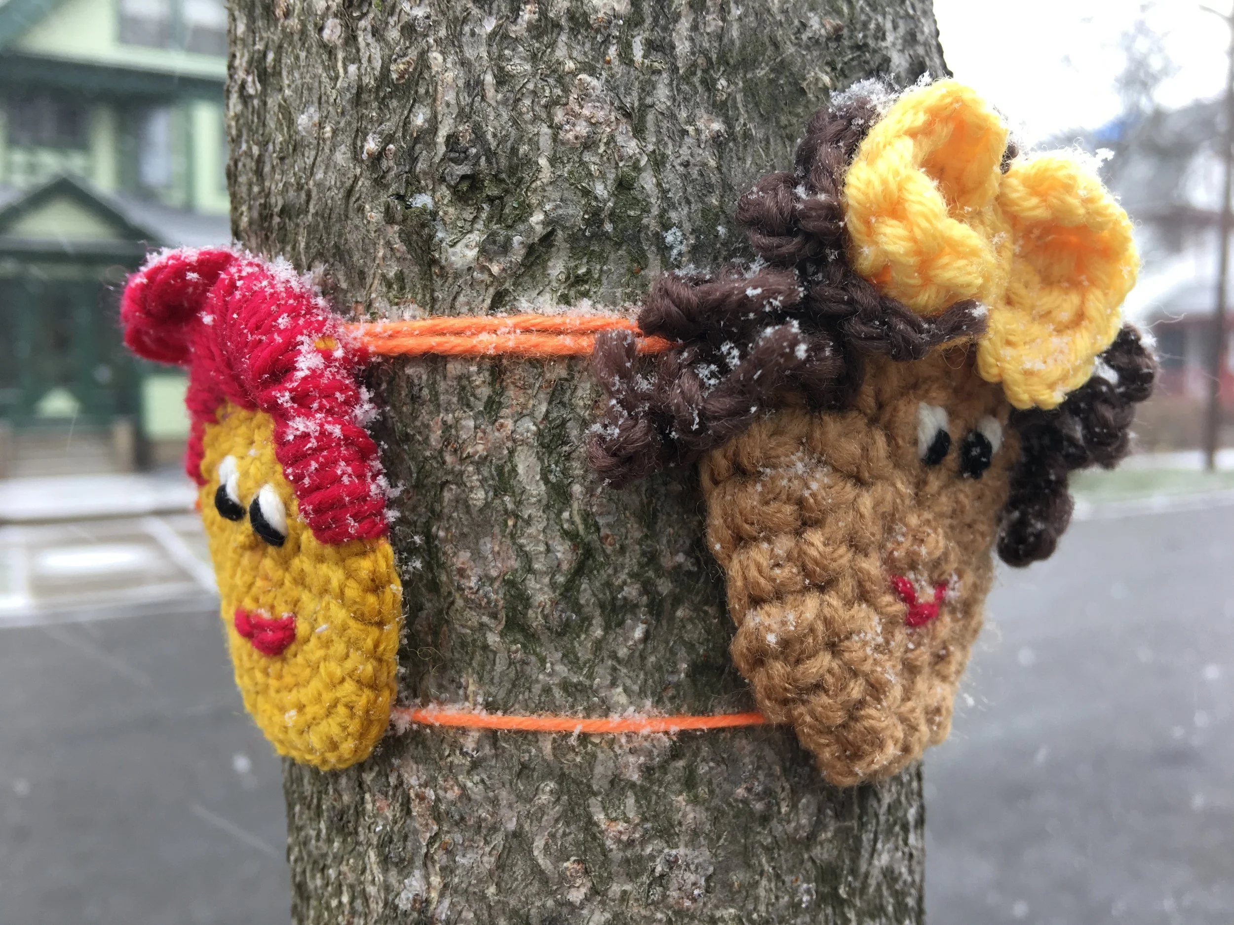 Photo by Hinda Mandell: The author's crochet faces outside the Susan B. Anthony Museum & House in Rochester, New York, during winter 2017.